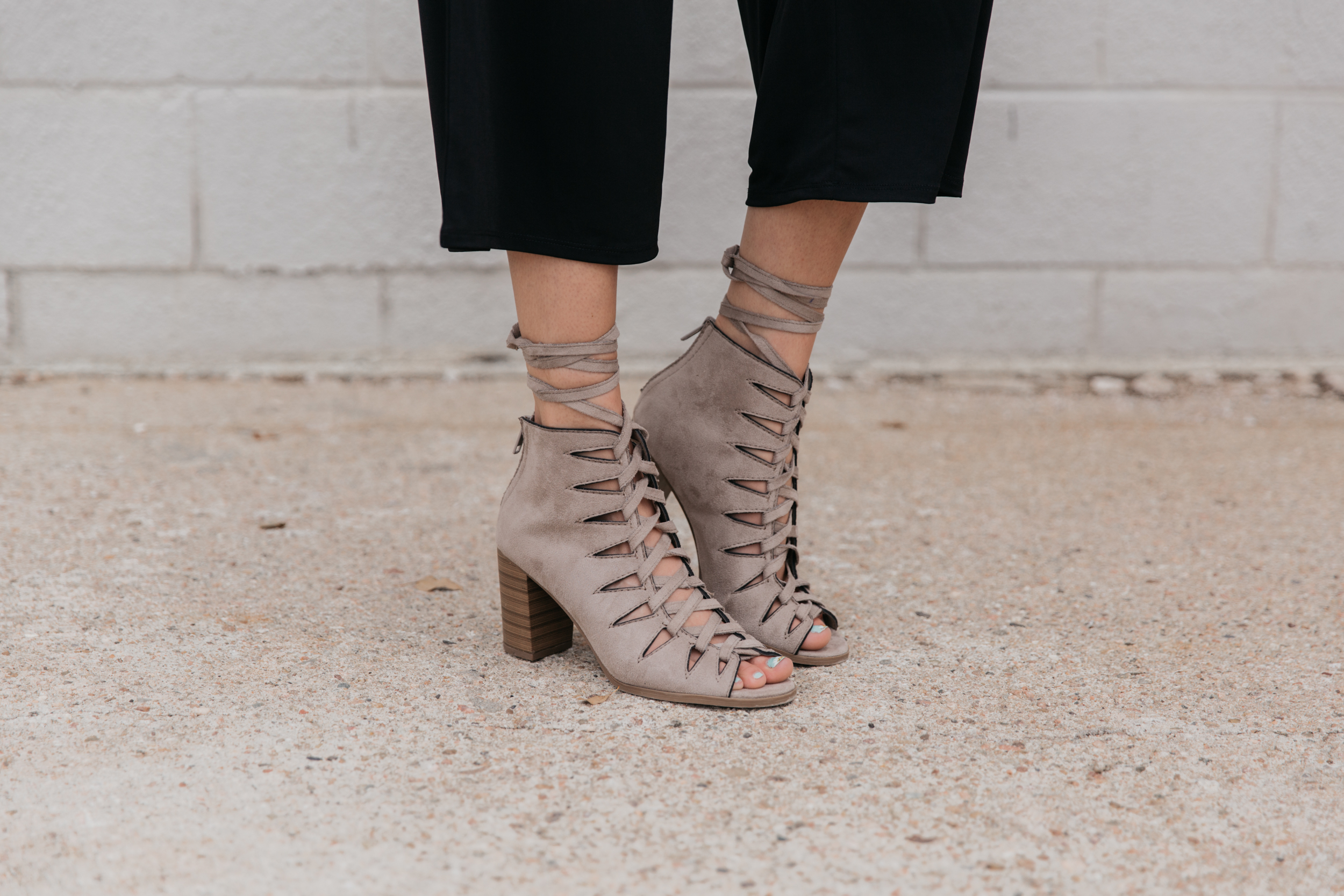 block trend heel with lace-up detailing.
